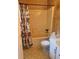 Bathroom features a floral shower curtain, tile floor and tub with accessibility bars at 4380 Highway 138, Oxford, GA 30054