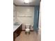 Bathroom features a marble countertop, tile floor and blue tile shower surround at 4380 Highway 138, Oxford, GA 30054