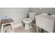 Bathroom features a toilet and sink, with miscellaneous items on the side at 1016 Green Dr, Canton, GA 30114