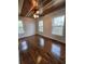 Primary bedroom featuring hardwood floors, three windows, and a wood ceiling at 1016 Green Dr, Canton, GA 30114