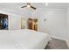 Bright bedroom features walk-in closet, ensuite bathroom, and ceiling fan at 1016 Green Dr, Canton, GA 30114