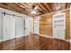 Bedroom featuring hardwood floors, statement wall, built in shelves and drawers at 1016 Green Dr, Canton, GA 30114