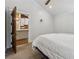 Bedroom features a view to the kitchen, a white comforter, and grey carpet at 1016 Green Dr, Canton, GA 30114