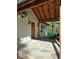 Covered front entrance with stone patio and beautiful wood door and ceiling at 1016 Green Dr, Canton, GA 30114