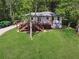 Exterior of home with large deck and stairs in backyard at 1016 Green Dr, Canton, GA 30114