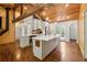 Kitchen with a large island, stainless steel appliances, wood-paneled ceiling, and hardwood floors at 1016 Green Dr, Canton, GA 30114