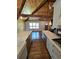 Bright kitchen featuring stainless appliances, white cabinets, and views into the large main living area at 1016 Green Dr, Canton, GA 30114