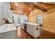 Bright kitchen with a large island, stainless steel appliances, and wood-paneled ceiling with exposed beams at 1016 Green Dr, Canton, GA 30114