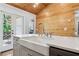 Kitchen island with a farmhouse sink and stainless steel appliances, under a wood-paneled ceiling at 1016 Green Dr, Canton, GA 30114