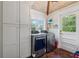 Laundry room with side by side washer and dryer and brick tile flooring at 1016 Green Dr, Canton, GA 30114