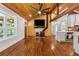 Bright living room showcasing wood ceiling, open layout, fireplace, and adjacent modern kitchen at 1016 Green Dr, Canton, GA 30114