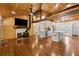 Spacious living area with wood floors, wood ceiling, open kitchen, and cozy wood-burning stove at 1016 Green Dr, Canton, GA 30114