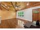 Bright living room features wood floors, vaulted ceiling with fan, and natural light at 1016 Green Dr, Canton, GA 30114
