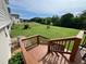 This backyard shows off the deck, the fenced in yard, and the lush green grass at 19 Magnolia Ne Ct, Rydal, GA 30171