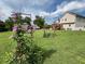 This beautiful backyard shows off the manicured lawn, the flower trellis, and the home at 19 Magnolia Ne Ct, Rydal, GA 30171