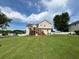 Spacious backyard featuring lush lawn, mature trees and a screened-in deck perfect for outdoor entertaining at 19 Magnolia Ne Ct, Rydal, GA 30171