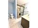 Bathroom featuring a stylish glass door shower with stone floor and light blue walls at 19 Magnolia Ne Ct, Rydal, GA 30171