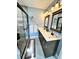 Updated bathroom featuring a shower with glass enclosure, vanity with dual sinks, and modern fixtures at 19 Magnolia Ne Ct, Rydal, GA 30171