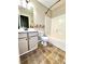 Well-lit bathroom featuring a vanity, toilet, and shower/tub combo at 19 Magnolia Ne Ct, Rydal, GA 30171
