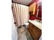 Functional bathroom with shower and tub combination, single vanity, and tile floors at 19 Magnolia Ne Ct, Rydal, GA 30171
