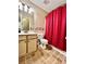 Bathroom features a vanity sink and shower behind a red curtain at 19 Magnolia Ne Ct, Rydal, GA 30171