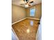 Neutral bedroom featuring natural light, ceiling fan, and wood laminate flooring at 19 Magnolia Ne Ct, Rydal, GA 30171