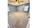 Neutral bedroom with carpet, ceiling fan, and two windows with blinds at 19 Magnolia Ne Ct, Rydal, GA 30171