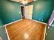 Bedroom with laminate flooring, ceiling fan, and white double doors at 19 Magnolia Ne Ct, Rydal, GA 30171