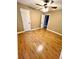 Bedroom with hardwood floors, ceiling fan, and two doors at 19 Magnolia Ne Ct, Rydal, GA 30171