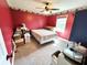 Modest bedroom with red walls, neutral carpet, and a window for natural light at 19 Magnolia Ne Ct, Rydal, GA 30171