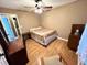 Cozy bedroom with hardwood flooring, good natural light, and classic furnishings at 19 Magnolia Ne Ct, Rydal, GA 30171