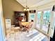 Inviting dining room with classic wood furniture and a charming chandelier at 19 Magnolia Ne Ct, Rydal, GA 30171