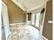 Eat-in kitchen with French doors to a deck, and modern light fixture at 19 Magnolia Ne Ct, Rydal, GA 30171