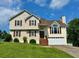 Two-story home with vinyl siding, brown shutters, and a well-manicured front lawn on a sunny day at 19 Magnolia Ne Ct, Rydal, GA 30171