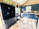 Bright kitchen boasts custom blue cabinets and modern stainless-steel appliances at 19 Magnolia Ne Ct, Rydal, GA 30171