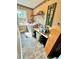 Bright laundry room with tiled floors, a shelf, and large window at 19 Magnolia Ne Ct, Rydal, GA 30171