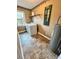 Laundry room with vinyl tile and large window at 19 Magnolia Ne Ct, Rydal, GA 30171
