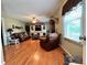 Cozy living room features hardwood floors, windows and comfortable seating at 19 Magnolia Ne Ct, Rydal, GA 30171
