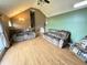 Open living room featuring hardwood floors, vaulted ceilings, and comfortable seating at 19 Magnolia Ne Ct, Rydal, GA 30171