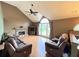 Living room with hardwood floors, a stone fireplace, and large windows for natural light at 19 Magnolia Ne Ct, Rydal, GA 30171