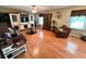 Inviting living room featuring hardwood floors, cozy furniture, and ample natural light at 19 Magnolia Ne Ct, Rydal, GA 30171