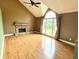 Spacious living room with vaulted ceilings, fireplace, and large window at 19 Magnolia Ne Ct, Rydal, GA 30171