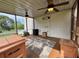 Inviting screened porch with ceiling fans, space heater, and black and white area rug at 19 Magnolia Ne Ct, Rydal, GA 30171