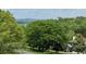 Scenic view of trees and mountains with houses in the distance at 19 Magnolia Ne Ct, Rydal, GA 30171