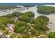 Aerial view of waterfront community with many boat slips on a beautiful lake at 2555 Chattahoochee Ln, Cumming, GA 30041