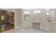 Bathroom featuring double vanities, marble countertop, and access to walk-in closet at 2555 Chattahoochee Ln, Cumming, GA 30041