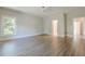 Hardwood floors and natural light fill this bedroom offering a calm, soothing atmosphere at 2555 Chattahoochee Ln, Cumming, GA 30041