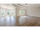 Large primary bedroom with tray ceiling, lots of natural light, and neutral color palette at 2555 Chattahoochee Ln, Cumming, GA 30041