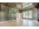 Sophisticated study featuring paneled walls, a tray ceiling, and bright, natural light at 2555 Chattahoochee Ln, Cumming, GA 30041