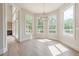 Bright sunroom with large windows and hardwood floors at 2555 Chattahoochee Ln, Cumming, GA 30041